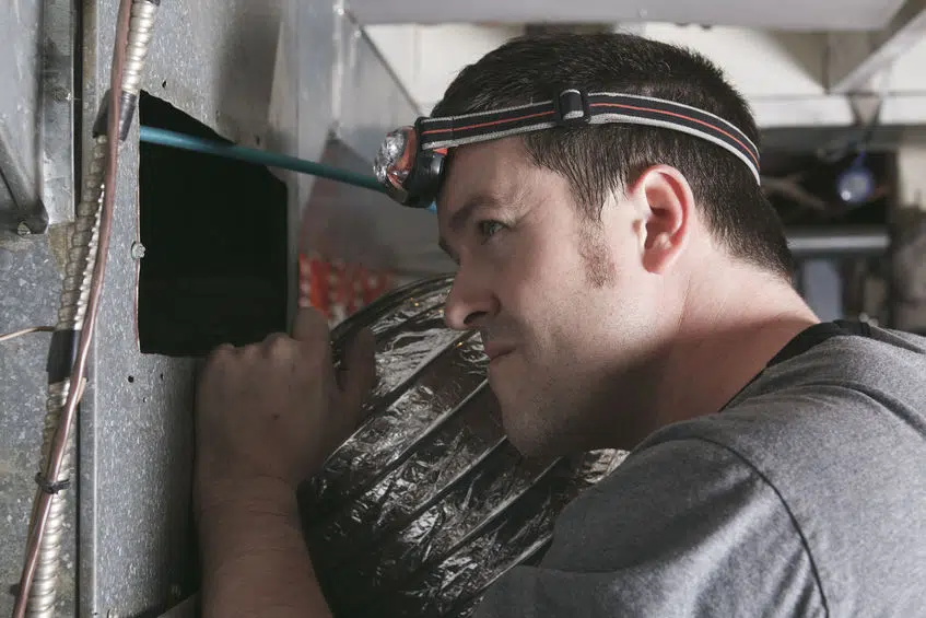 technician at work on air filter 